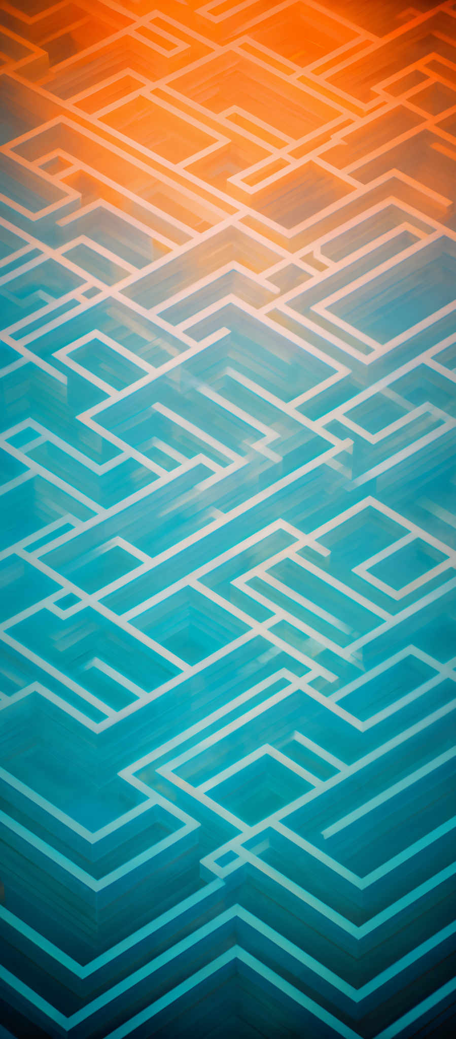 The image showcases a series of interconnected rectangular shapes in varying shades of blue and orange. The rectangles overlap and intersect in a complex maze-like pattern, creating a visually intricate design. The gradient of colors transitions from a deep blue at the top to a warm orange at the bottom, giving the image a dynamic and layered appearance.