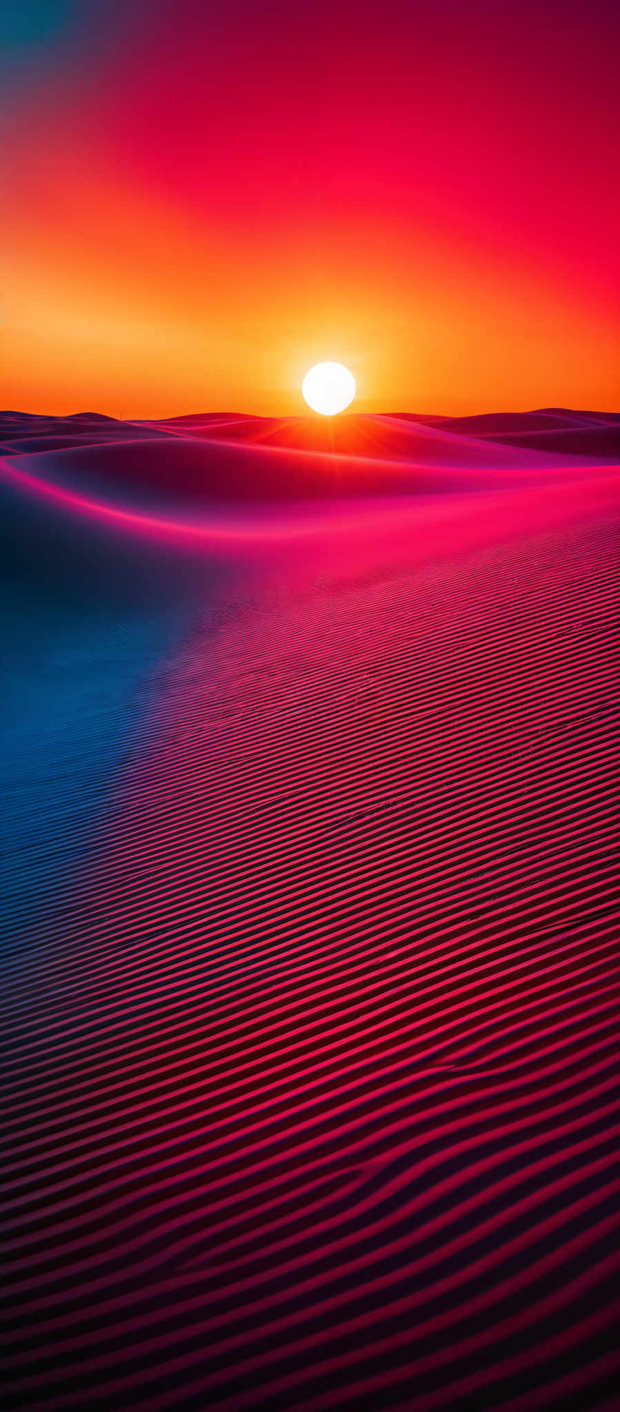 The image showcases a mesmerizing landscape during sunset. The sky is painted in hues of deep blue, transitioning to vibrant orange and then to a fiery red near the horizon. The sun is captured just above the horizon, casting a brilliant glow. The foreground features undulating sand dunes with intricate patterns created by the wind. The dunes exhibit a gradient of colors, from deep purple to bright orange, reflecting the sunset's glow and the play of shadows.