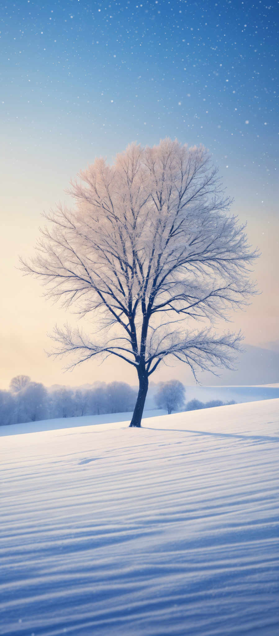 The image showcases a solitary tree standing in a vast snow-covered landscape. The tree is covered in a layer of frost or snow, giving it a white and crystalline appearance. The sky above is a gradient of blue, transitioning from a deeper shade at the top to a lighter hue near the horizon. It's dotted with numerous white specks, possibly representing snowflakes or stars. The ground is blanketed in undulating patterns of snow, creating a rhythmic texture.