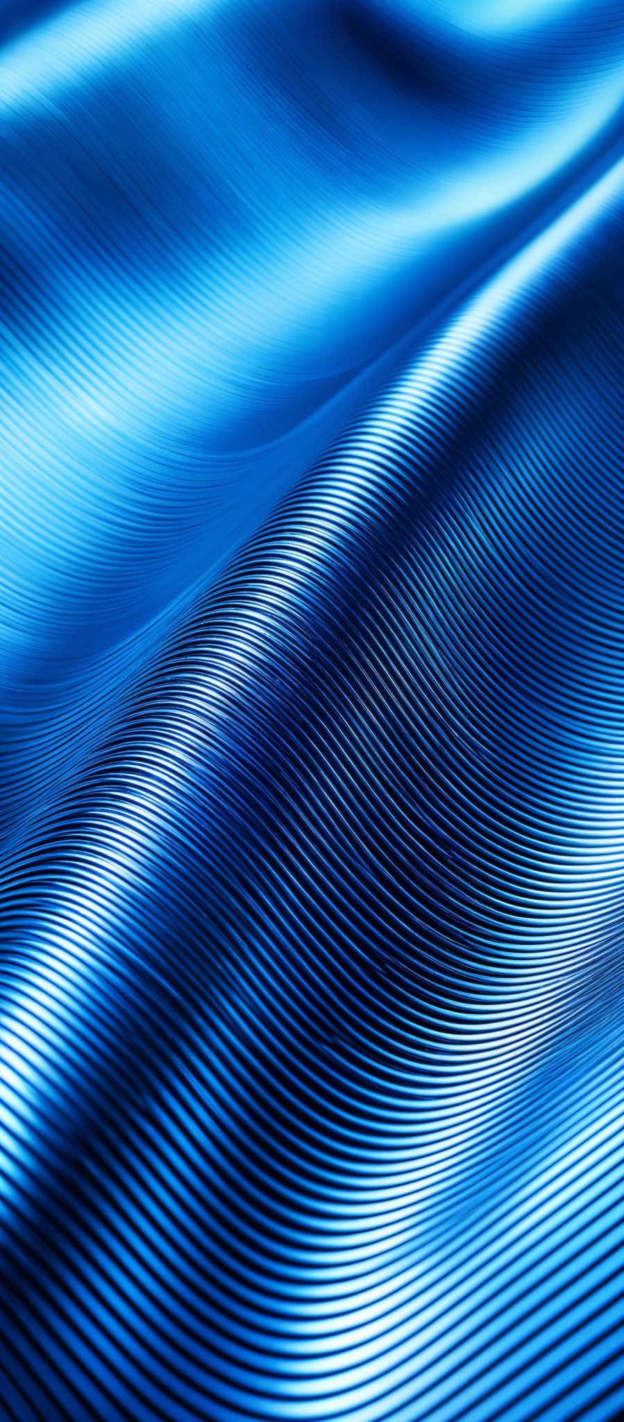 The image showcases a series of parallel, wavy lines in varying shades of blue. The lines create a flowing, undulating pattern, reminiscent of waves or ripples in water. The color palette is dominated by deep blues, transitioning to lighter shades, giving the image a dynamic and vibrant feel. The overall shape is abstract, emphasizing the rhythm and movement of the lines rather than any specific object or scene.