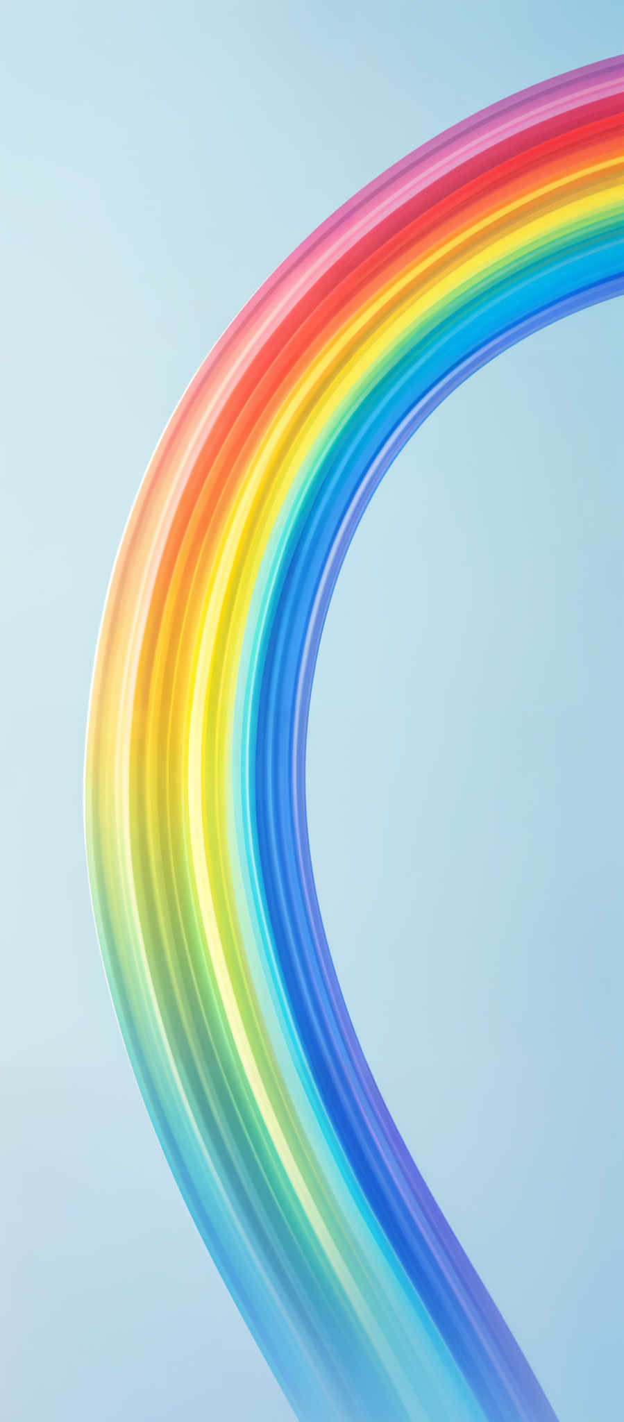 The image showcases a vibrant rainbow arc against a light blue background. The rainbow consists of multiple layers of color, transitioning from red at the top to orange, yellow, green, blue, indigo, and violet at the bottom. The colors are smoothly blended, giving the rainbow a fluid and dynamic appearance.