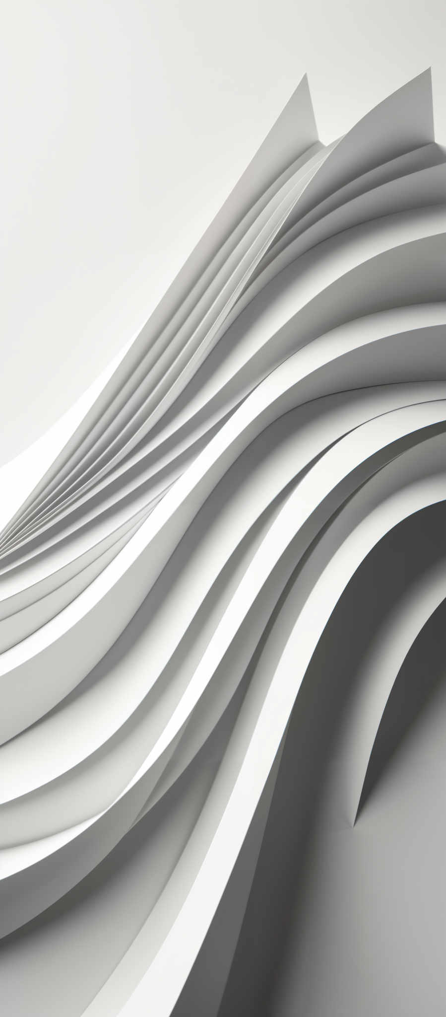 The image showcases a series of undulating, curved lines in a monochromatic palette. The lines are smooth and appear to be made of a material that reflects light, giving them a shiny appearance. The color scheme is predominantly white and gray, creating a minimalist and modern aesthetic. The shapes resemble waves or ripples, suggesting movement and fluidity.