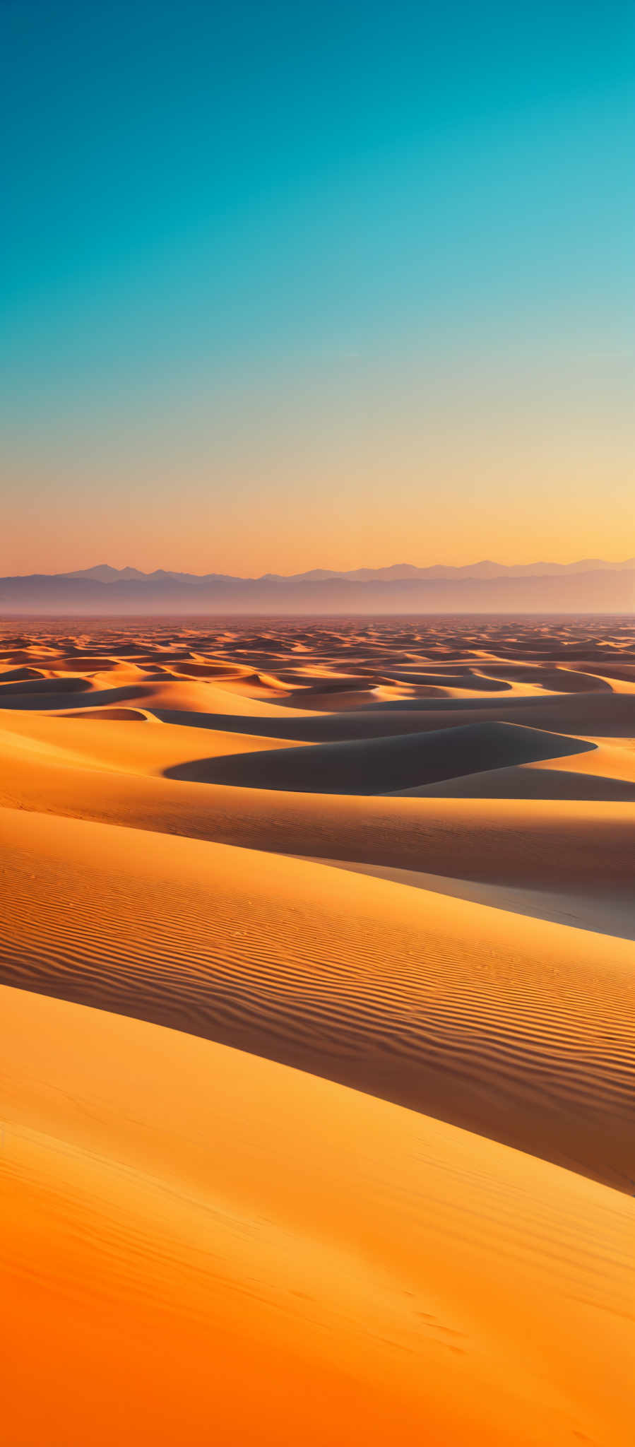 The image showcases a vast desert landscape with rolling sand dunes. The dunes exhibit a beautiful gradient of colors, transitioning from a deep orange near the base to a lighter, almost golden hue at the crest. The patterns on the dunes are intricate, with ripples and waves created by the wind. The sky above is clear with a gradient of blue, transitionning from a deeper shade at the top to a softer hue near the horizon. In the distance, there are faint outlines of mountains or hills.