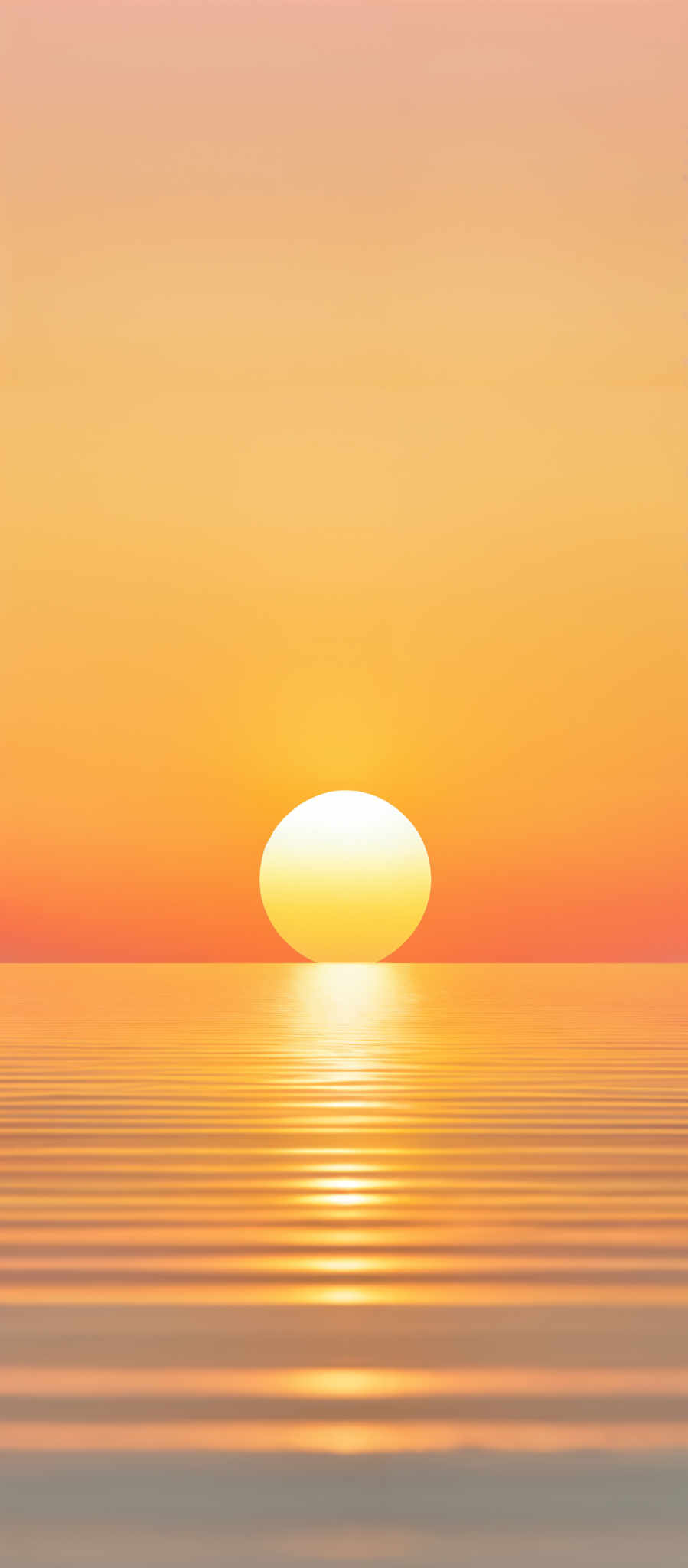 The image showcases a serene sunset over a calm body of water. The sky is painted in hues of orange, yellow, and a hint of pink, transitioning smoothly from the horizon upwards. The sun is captured just above the waterline, casting a brilliant reflection on the water's surface. The water itself reflects the colors of the sky, creating a harmonious gradient of colors. The overall ambiance of the image is tranquil and peaceful.