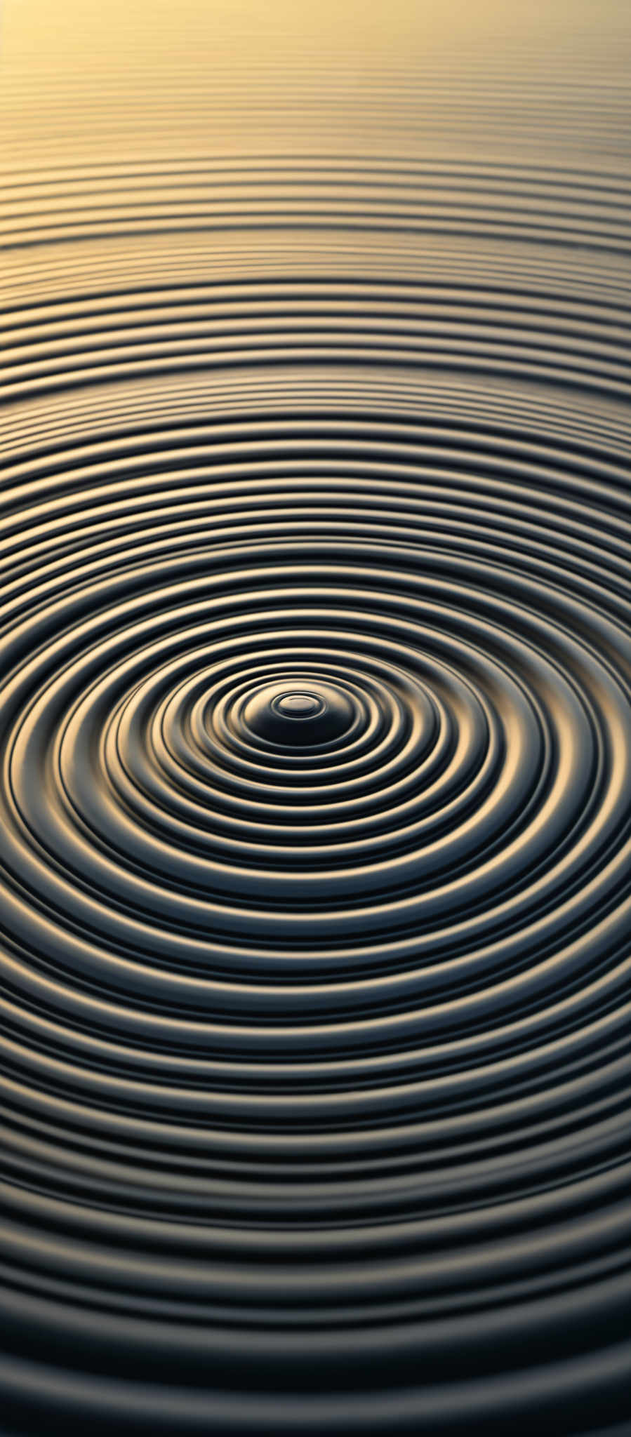 The image showcases concentric circles, creating a ripple effect. The color palette consists of varying shades of blue, transitioning from a darker hue at the outermost rings to a lighter, almost golden hue towards the center. The circles are rendered in a 3D manner, giving a sense of depth and dimension. The overall effect is reminiscent of water ripples or sound waves.