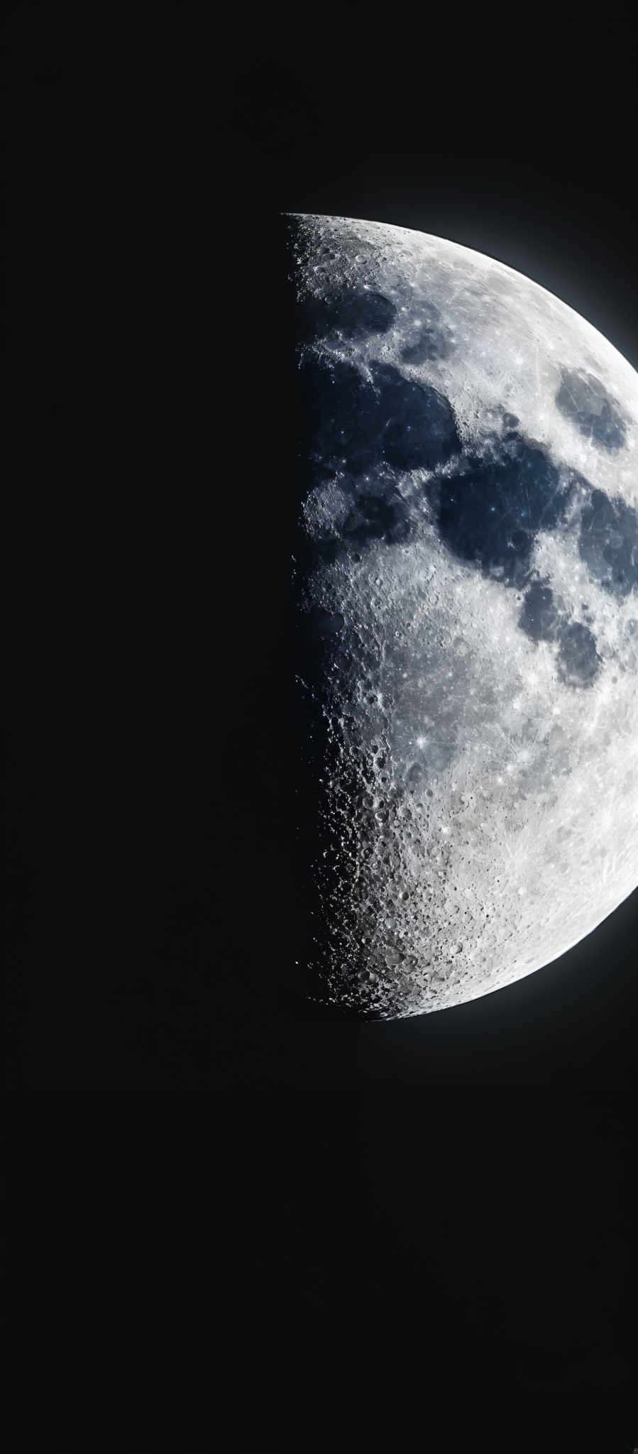 The image showcases a celestial body, which appears to be the moon. The moon's surface is depicted in varying shades of gray, with darker regions indicating the shadowed side and lighter regions highlighting the illuminated side. The surface is dotted with numerous craters, and there are visible textures and patterns that suggest the rugged and uneven terrain of the moon' s surface.