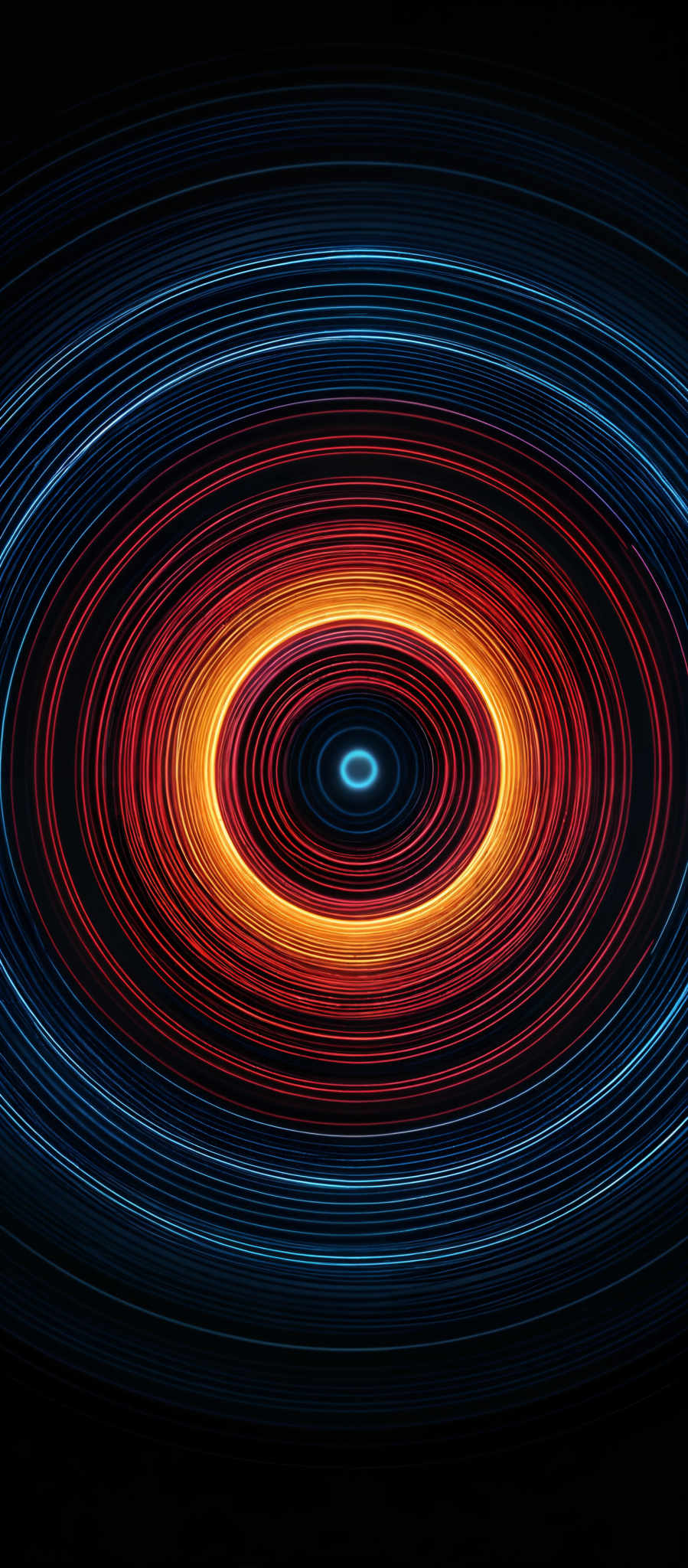 The image showcases a vibrant and mesmerizing pattern of concentric circles. The colors range from deep blues at the outermost rings to fiery reds and oranges at the innermost circle. The circles appear to be made of swirling lines, giving the impression of motion or energy. The overall shape resembles a spinning top or a vortex, with each ring getting progressively smaller as they move inward.