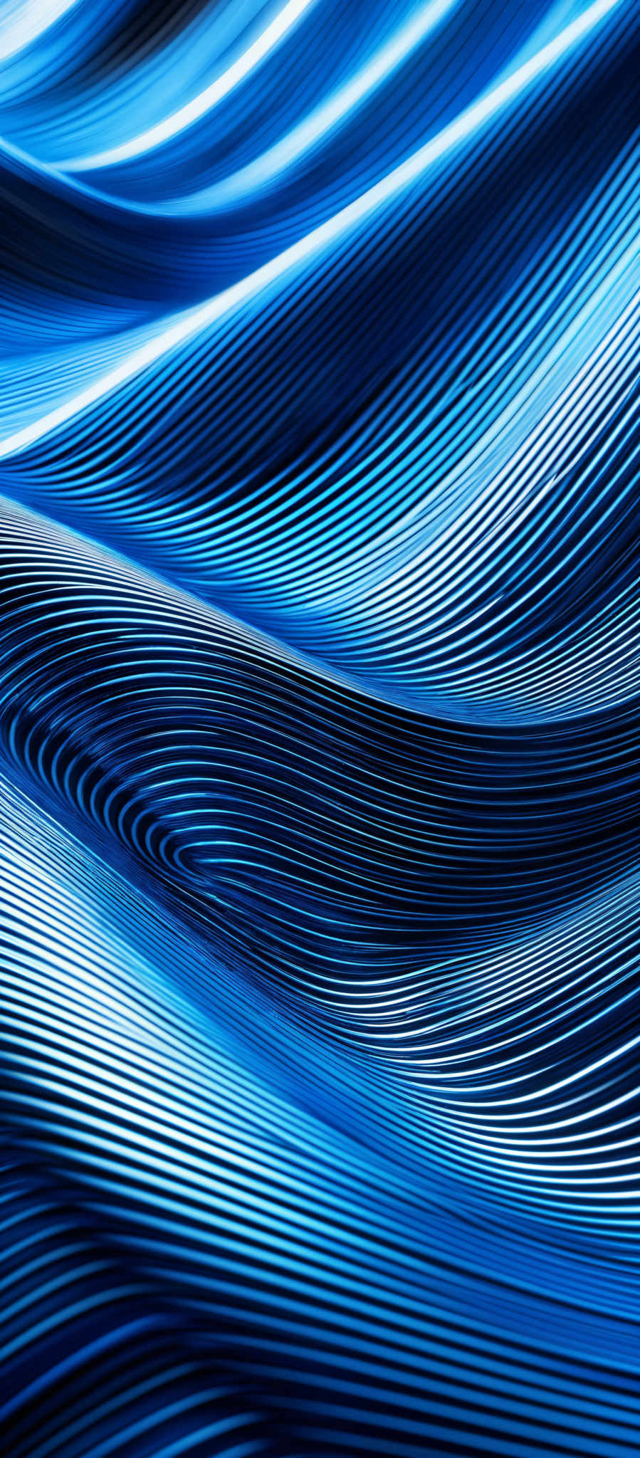 The image showcases a series of intertwined, wavy lines in varying shades of blue. The lines create a flowing, undulating pattern, reminiscent of waves or ripples in water. The color palette is dominated by deep blues, transitioning to lighter shades, giving the image a sense of depth and dimension. The overall shape is reminisccent of a 3D surface or topography, with the lines creating a sense that they are protruding from the background.