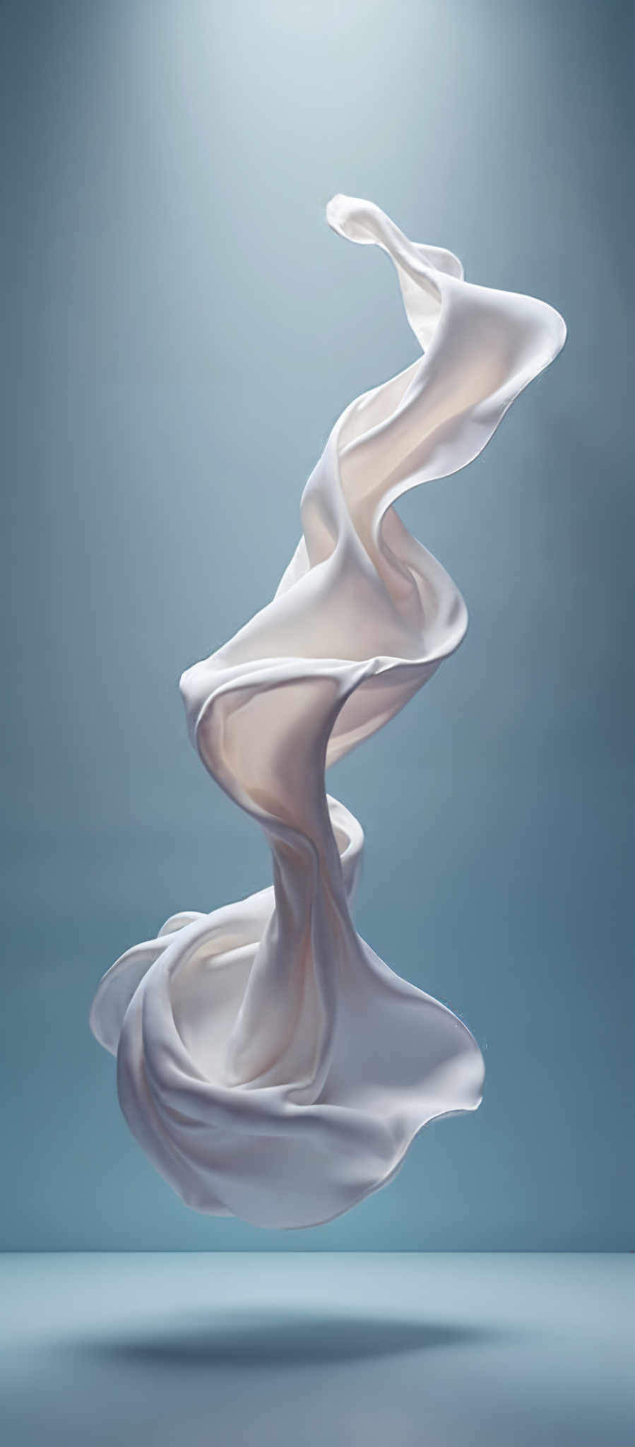 A white cloth with a flowing design is set against a blue background.