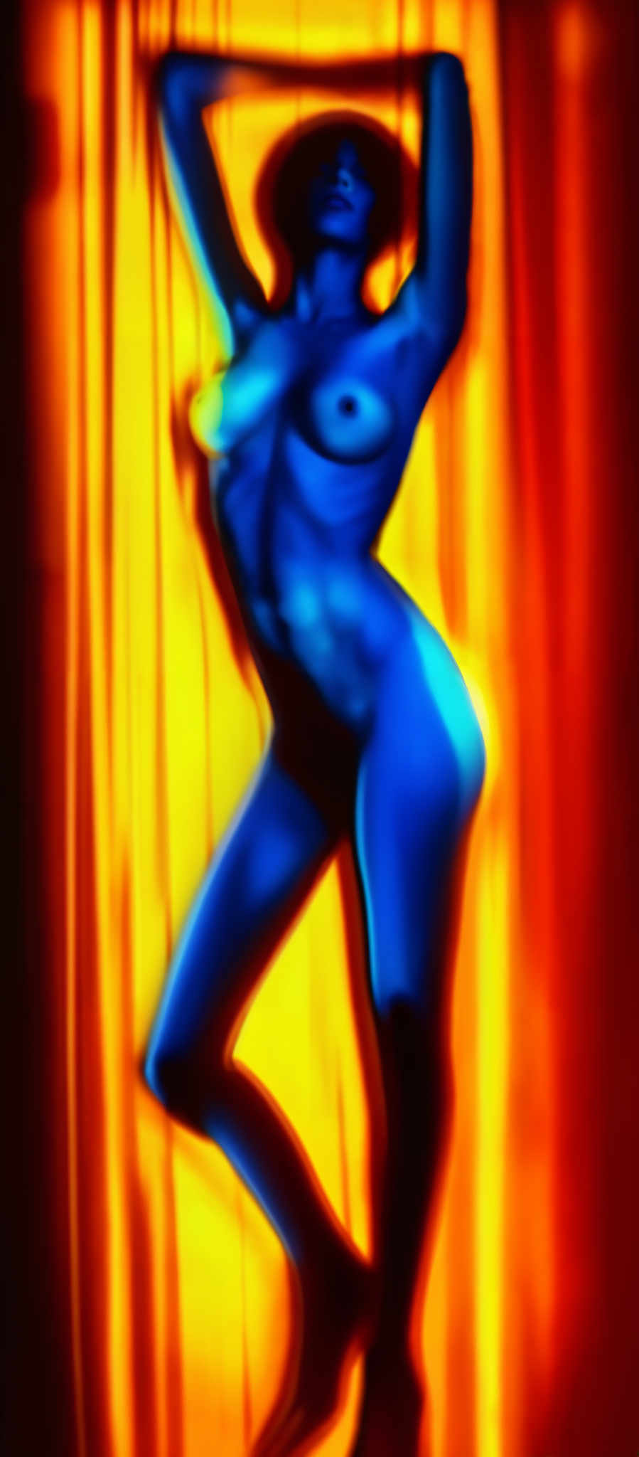 A blue woman in a dress with her arms outstretched., Arts & Photography Erotic Art Erotic Photography Nude Models Nude Model Photography Adult Models Adult Photography