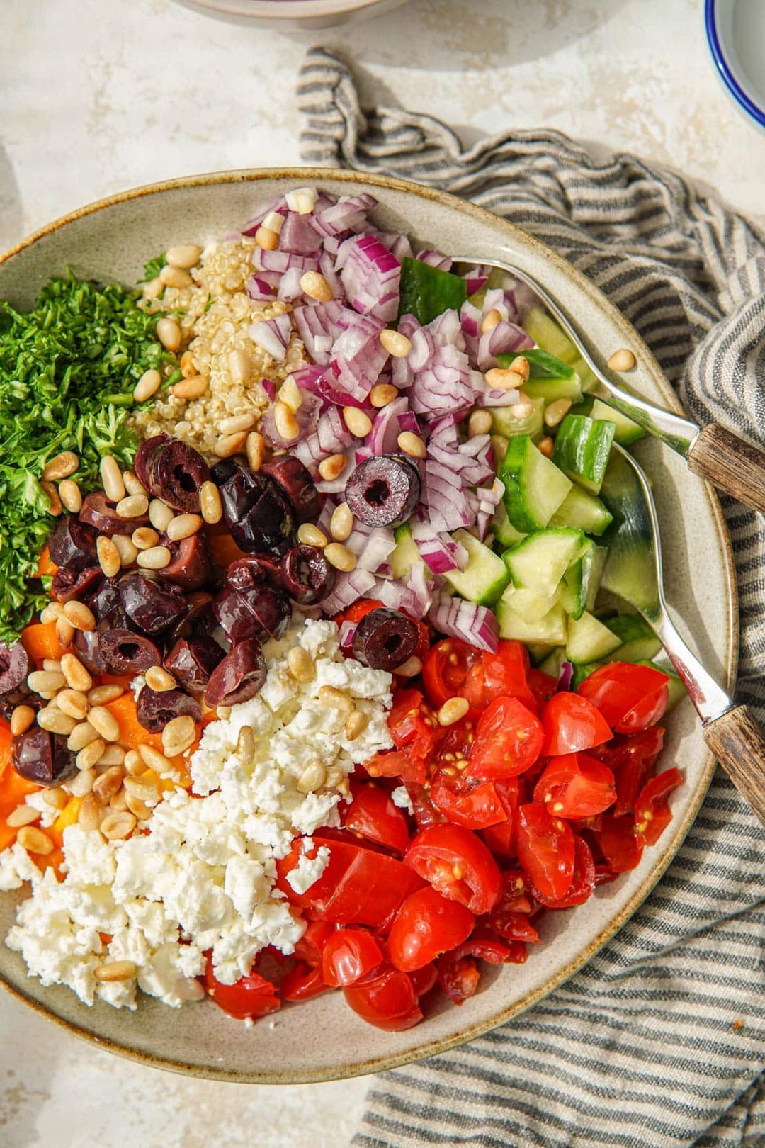 Greek quinoa salad with tomato, cucumber and bell pepper