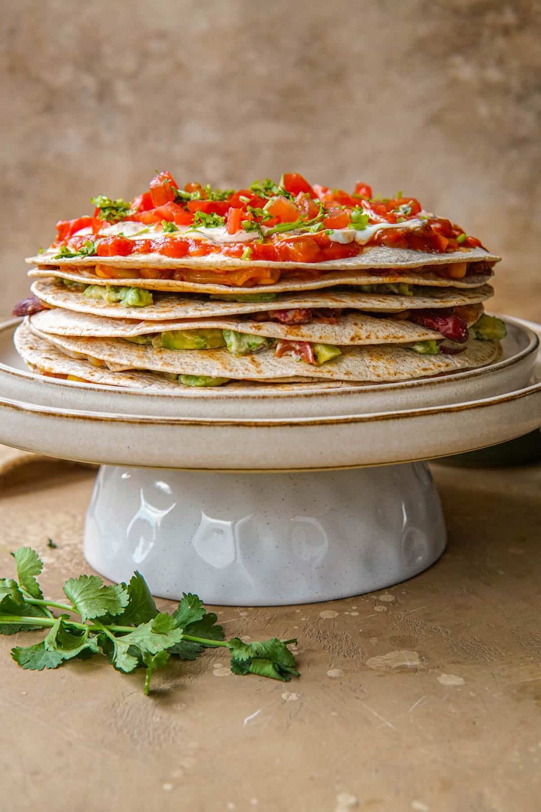 Vegetarian Mexican tortilla pie with kidney beans and guacamole