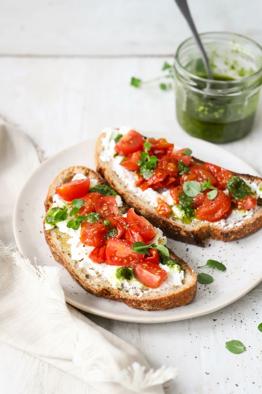 Lunch toast with ricotta, tomatoes and pesto