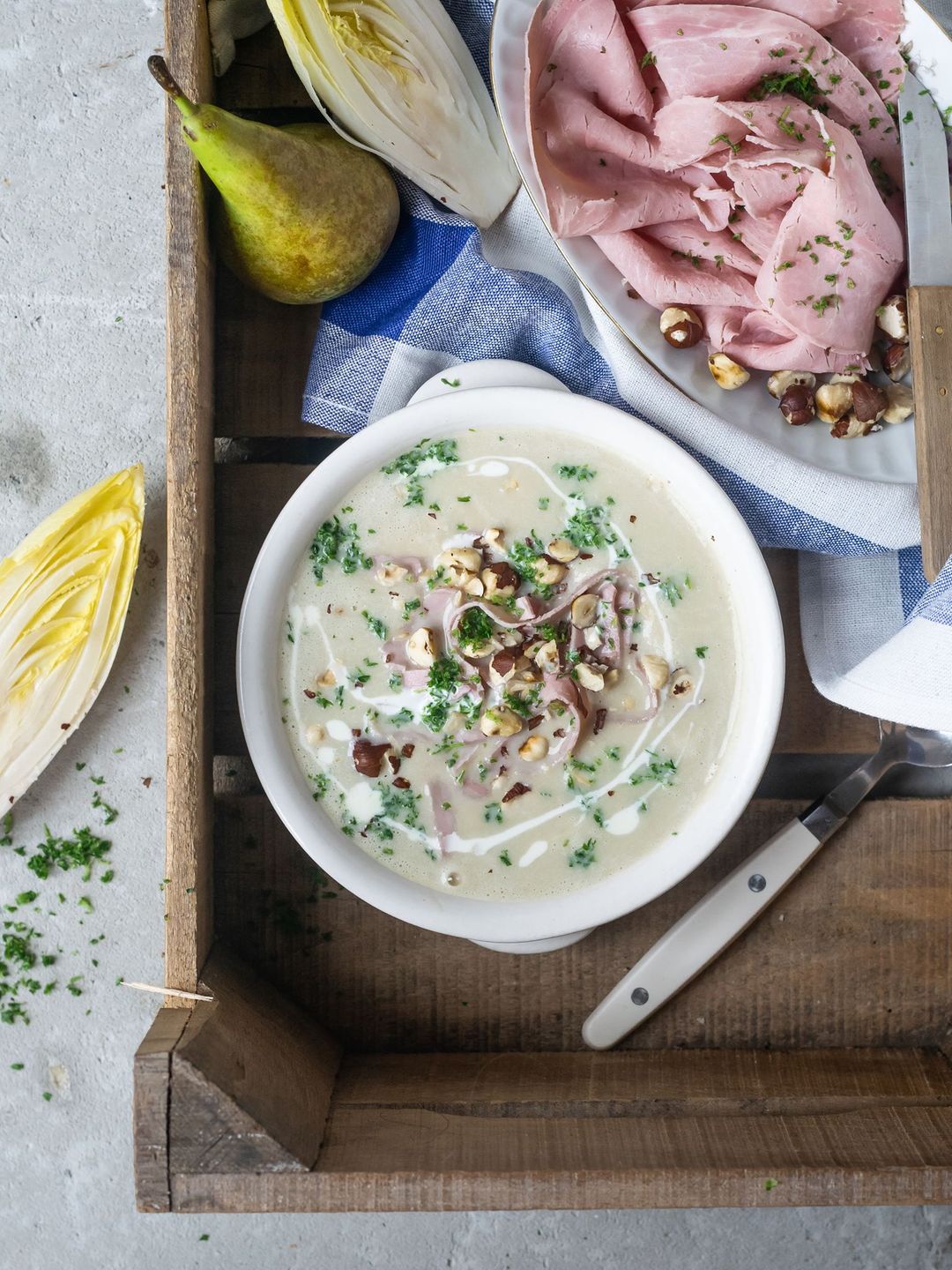 Chicory soup with pear, Meesterlyck ham and hazelnut