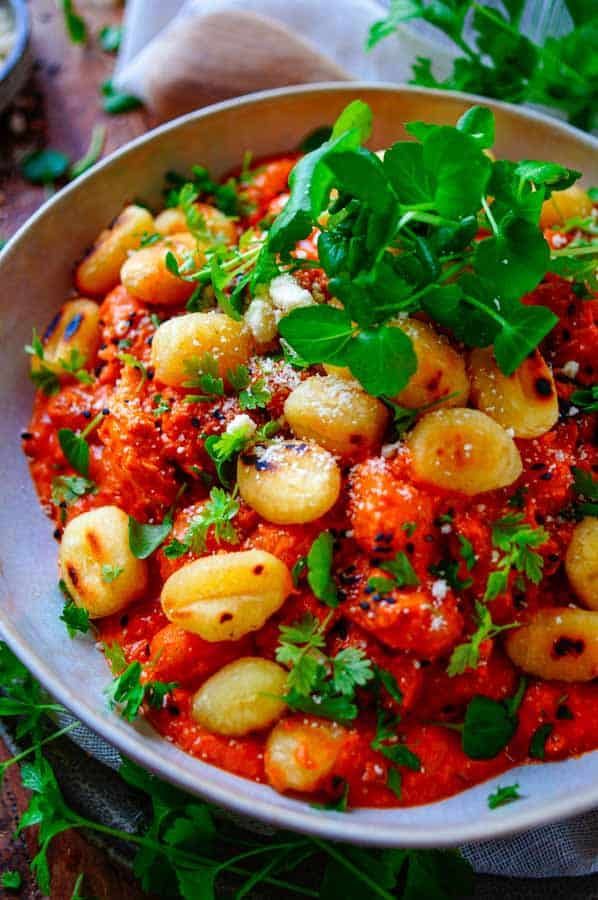 Chicken with bell pepper sauce and gnocchi