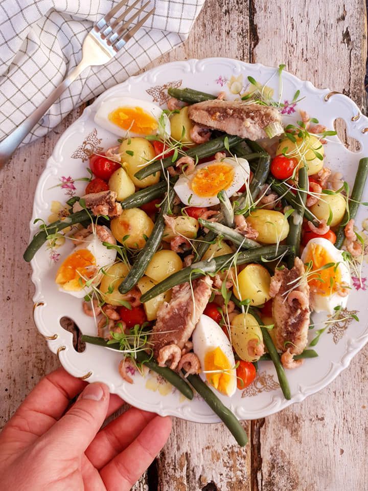 Salad with fine beans, potatoes, sardines, shrimp and a mustard honey dressing