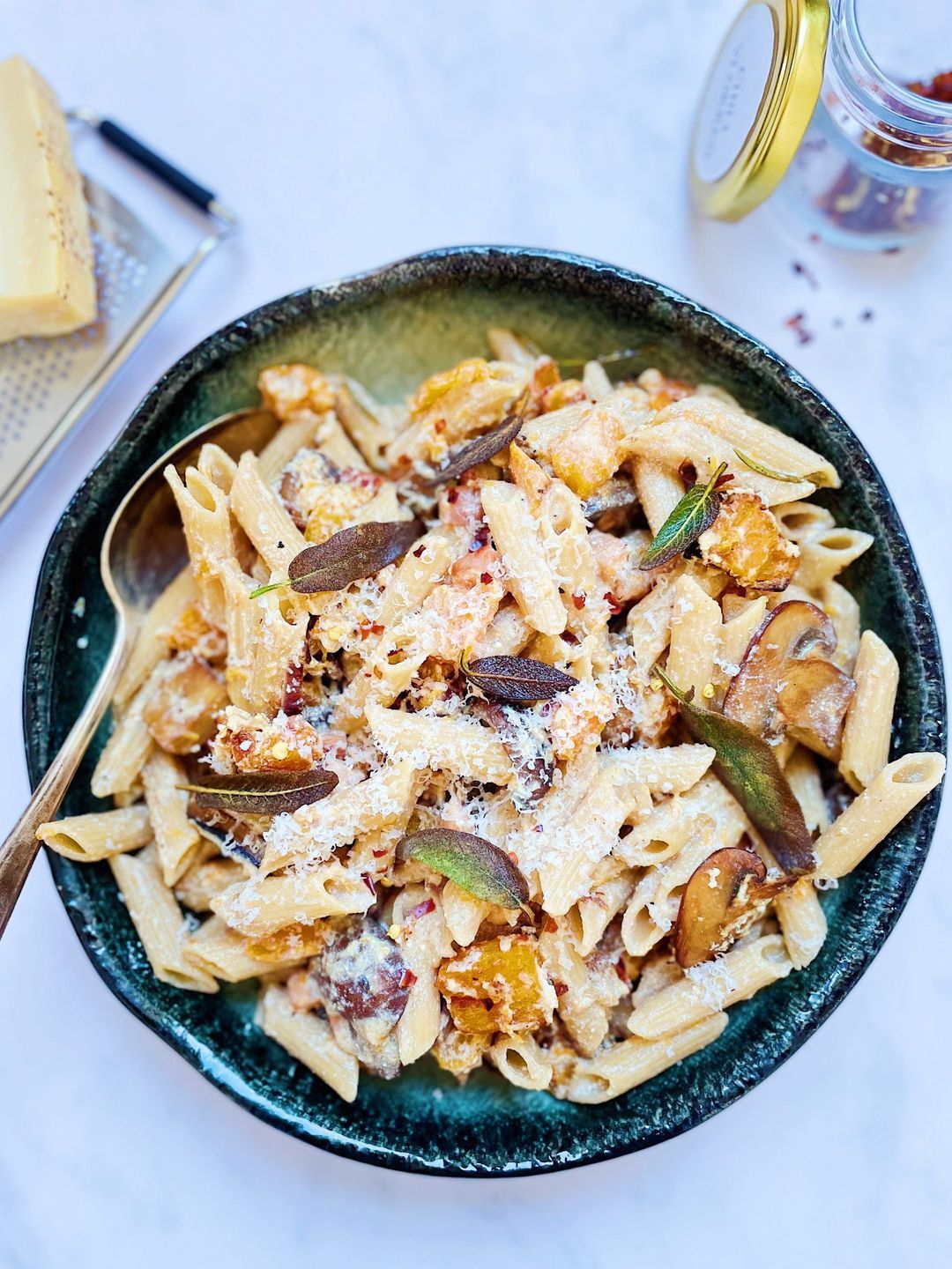 Pumpkin, mushrooms and ricotta pasta with bacon and fried sage