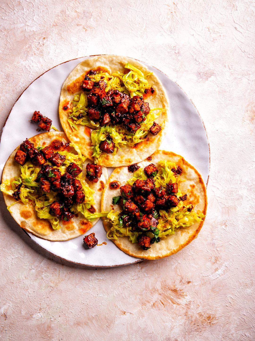 Wraps with sticky mustard tempeh and pointed cabbage