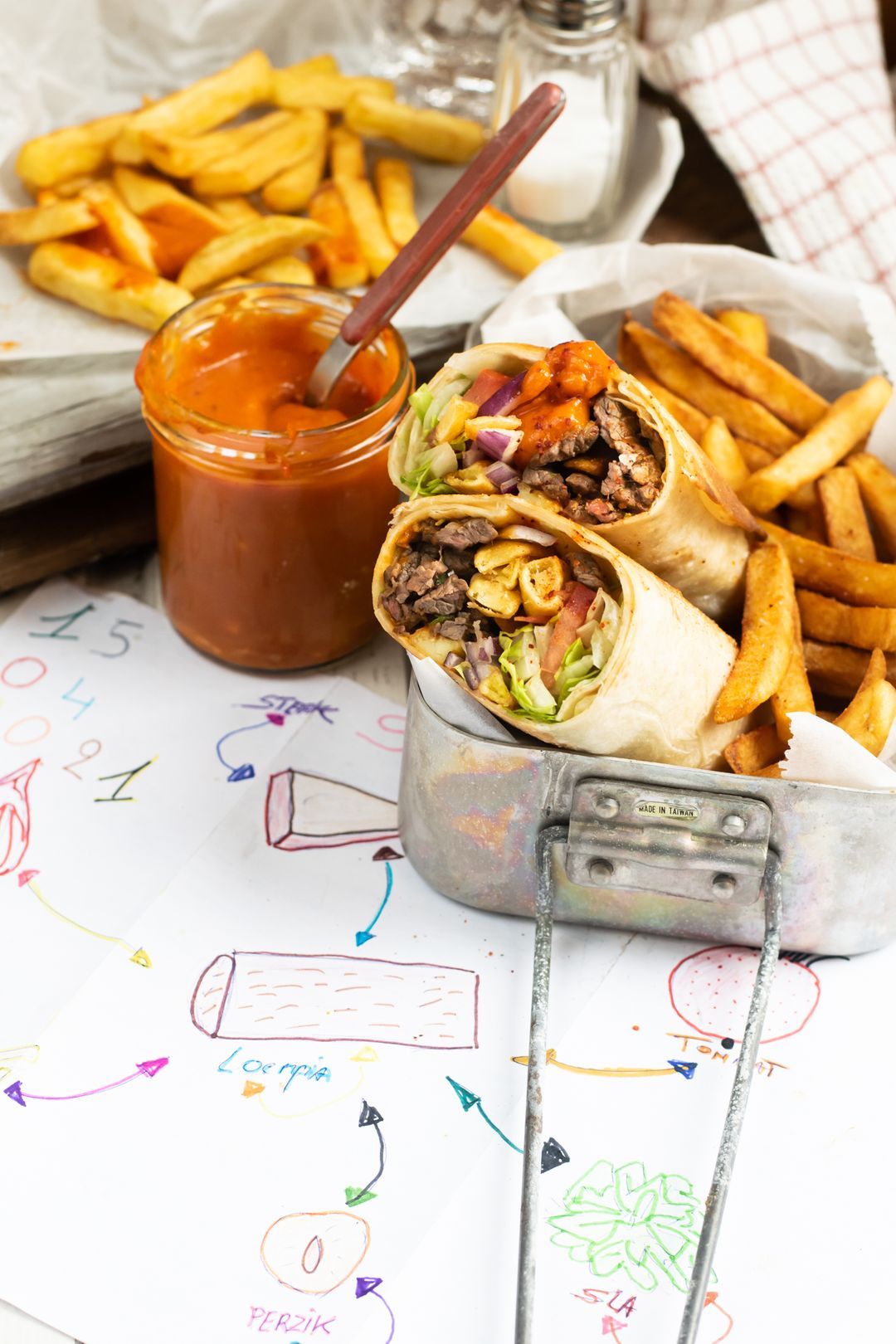 Burrito with steak, fries and peach ketchup