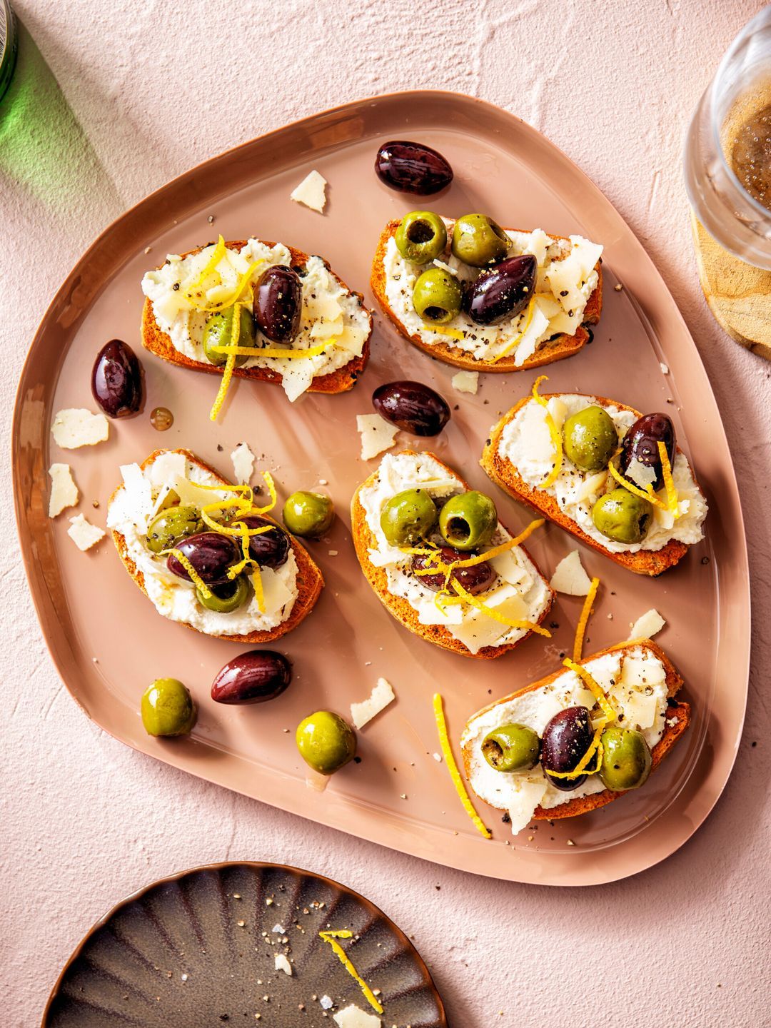 Bruschetta with parmesan cream and baked olives