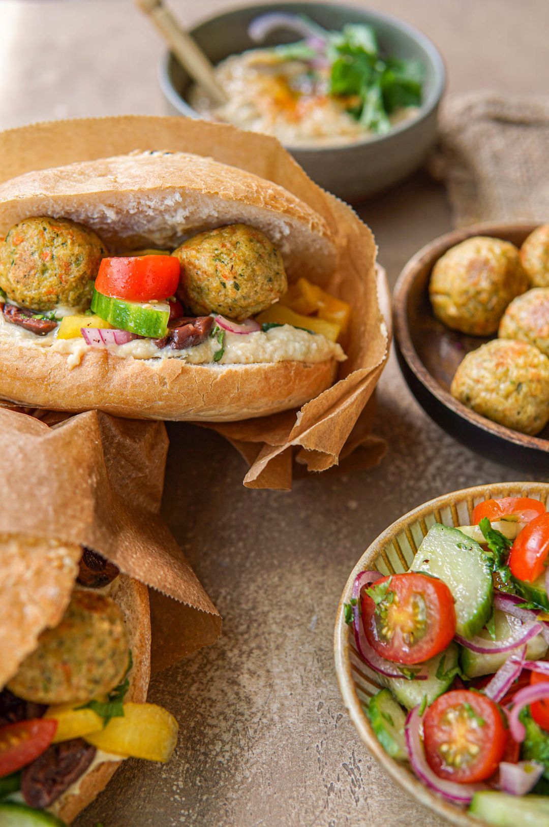 Falafel sandwich, hummus and fresh salad