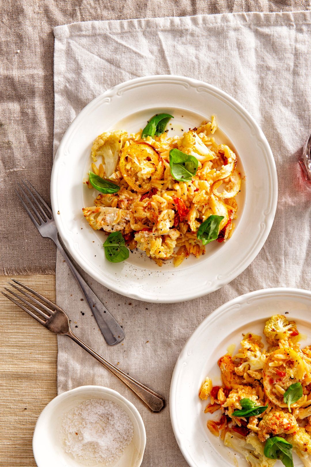 Baked feta with cauliflower, orzo and lemon