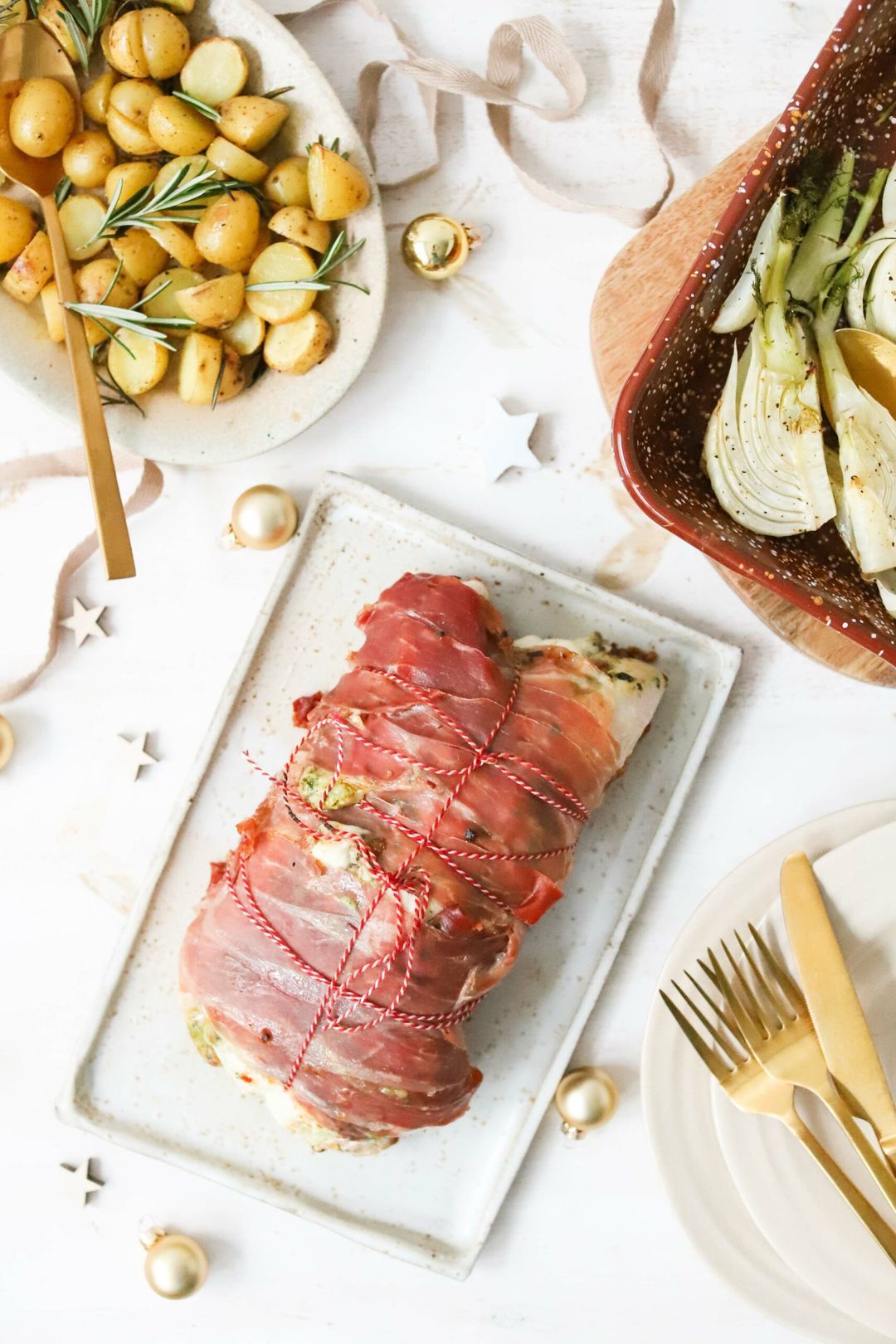 Turkey roulade with Parma ham, pesto, mozzarella, fennel and rosemary potatoes