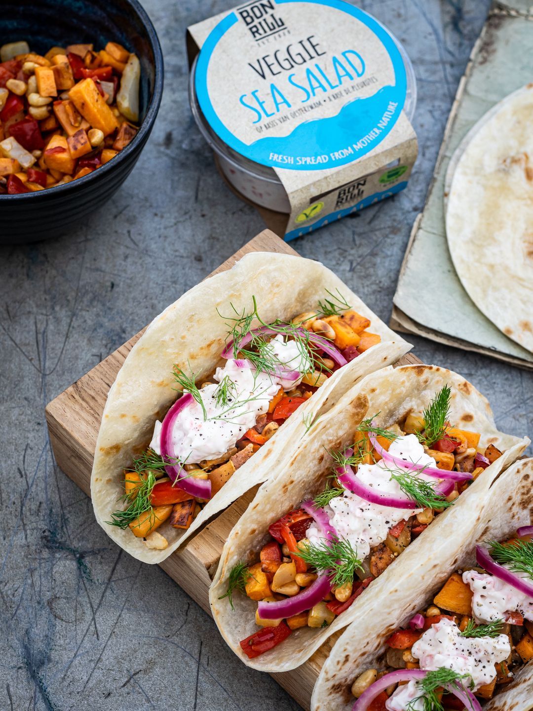 Tortilla with veggie sea salad, sweet potato and sweet and sour onion