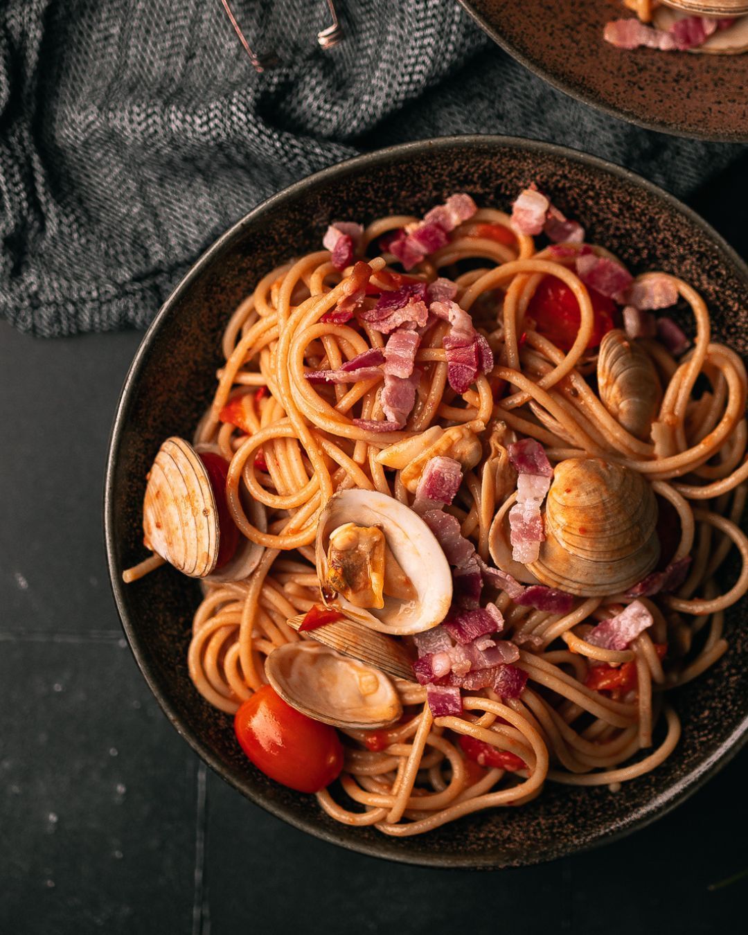 Surf & turf 🏄 ♂️ Spaghetti with clams met bacon & tomaat