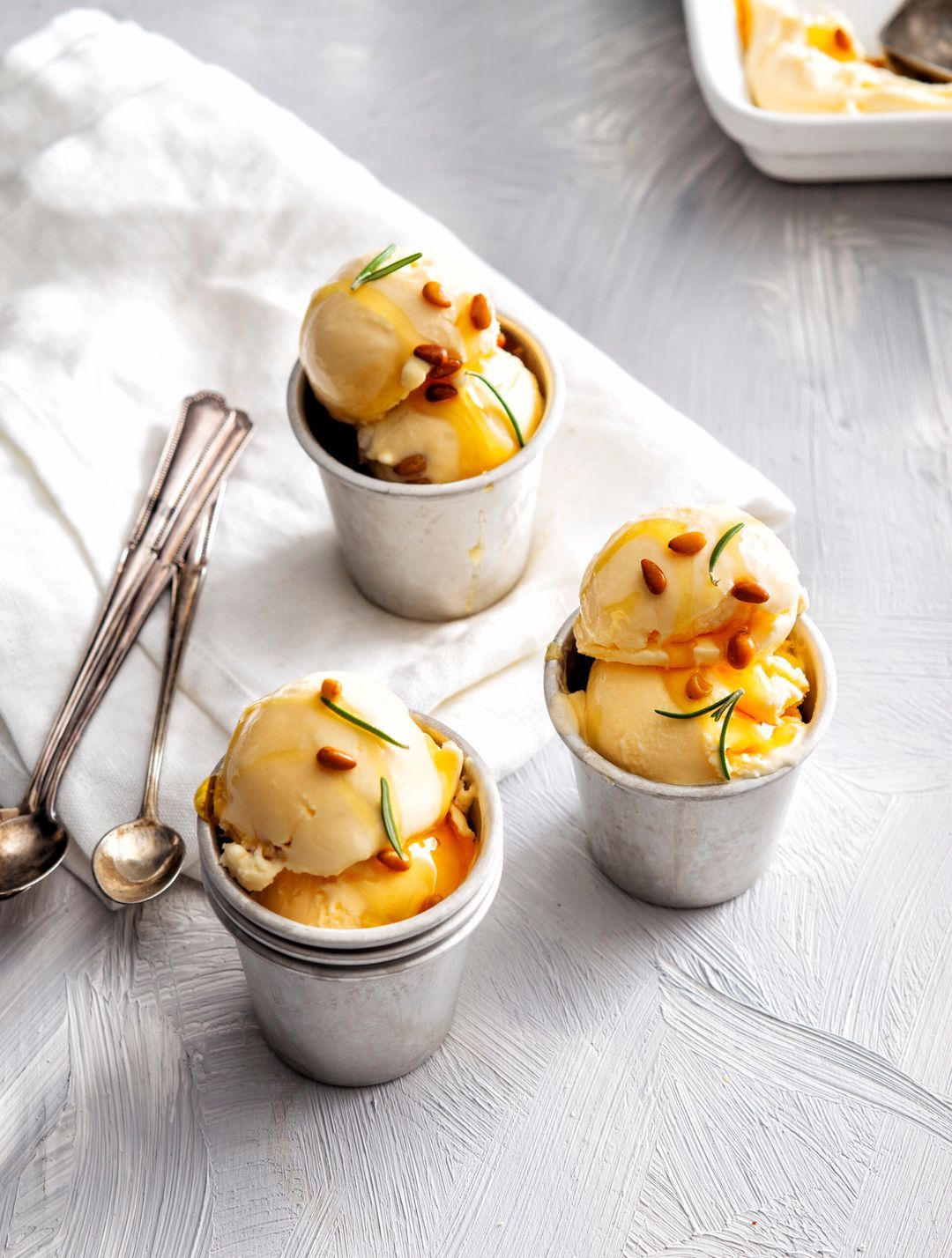 Buttermilk ice cream with rosemary, honey and pine nuts