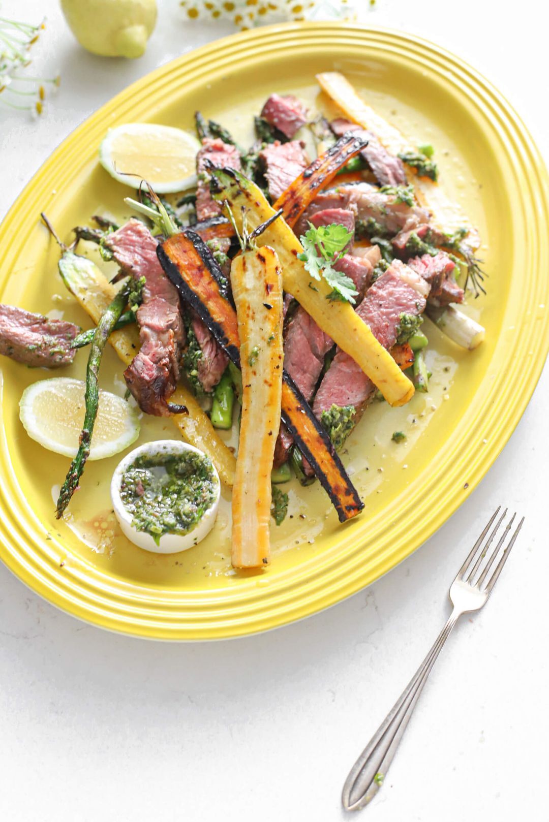 Grilled rib eye steak, carrots, pesto & lemon