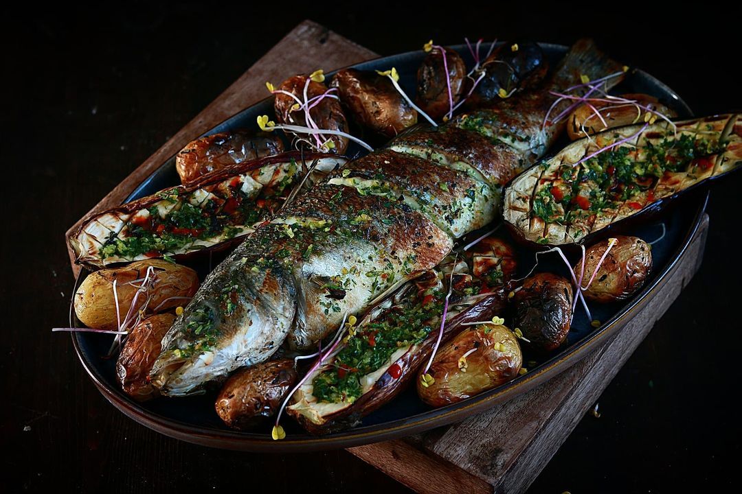 Delicious wood-grilled sea bass with fresh marinade