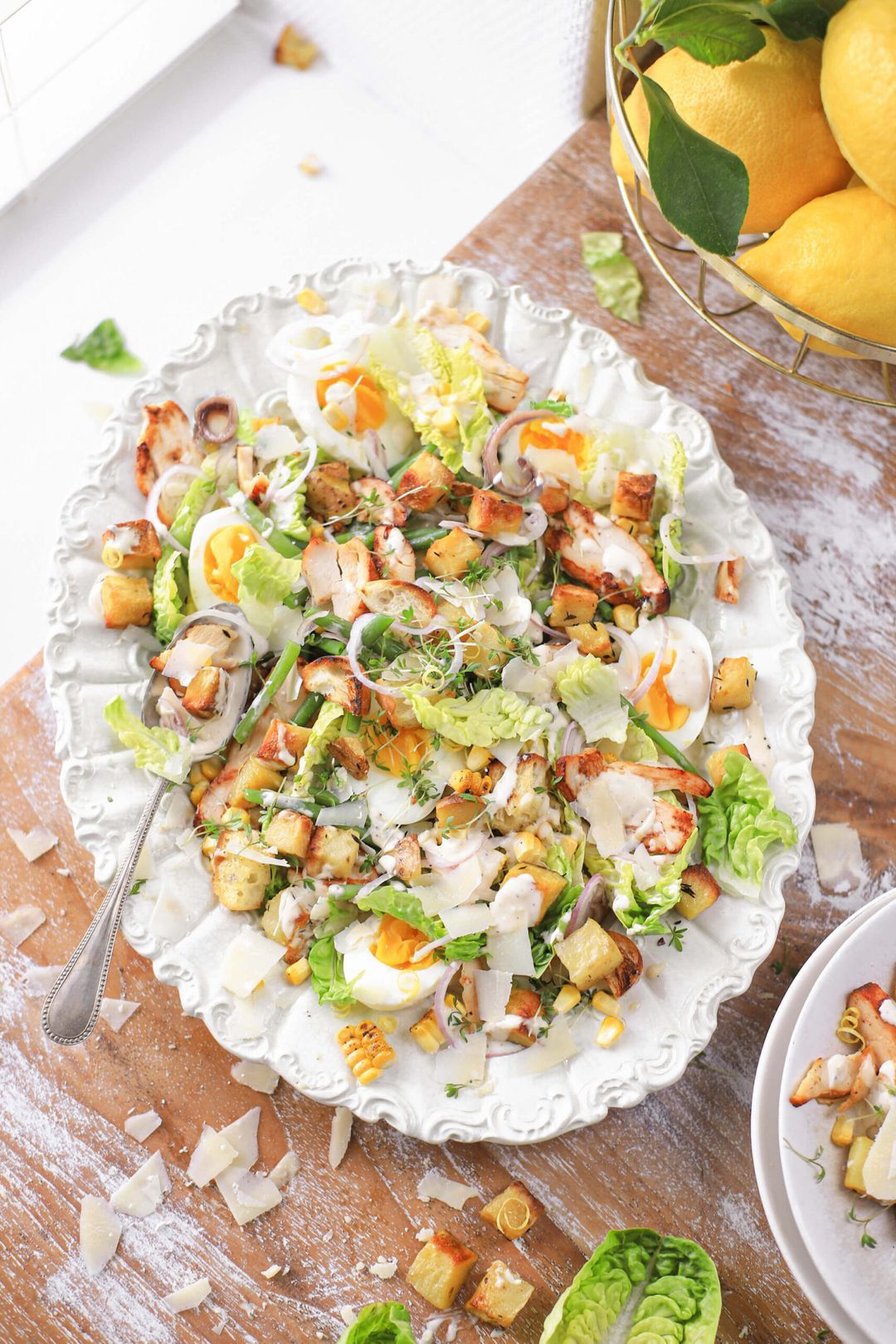Caesar salad with lemon, chicken, beans and anchovies