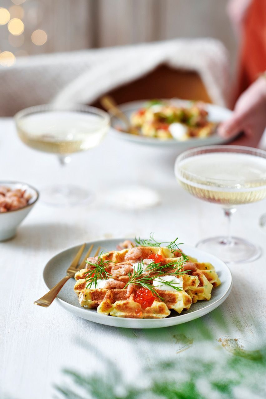 Savory potato wafers with shrimp, lump fish eggs and sour cream