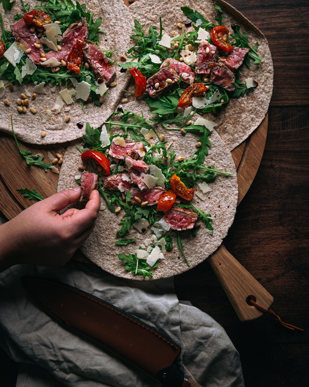 Italian wrap with steak, arugula, Parmesan cheese & pine nuts