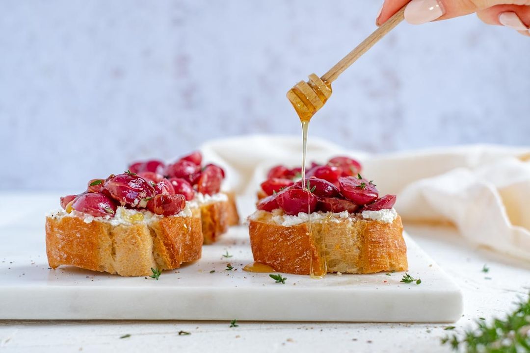 Bruschetta with grapes, ricotta and thyme honey