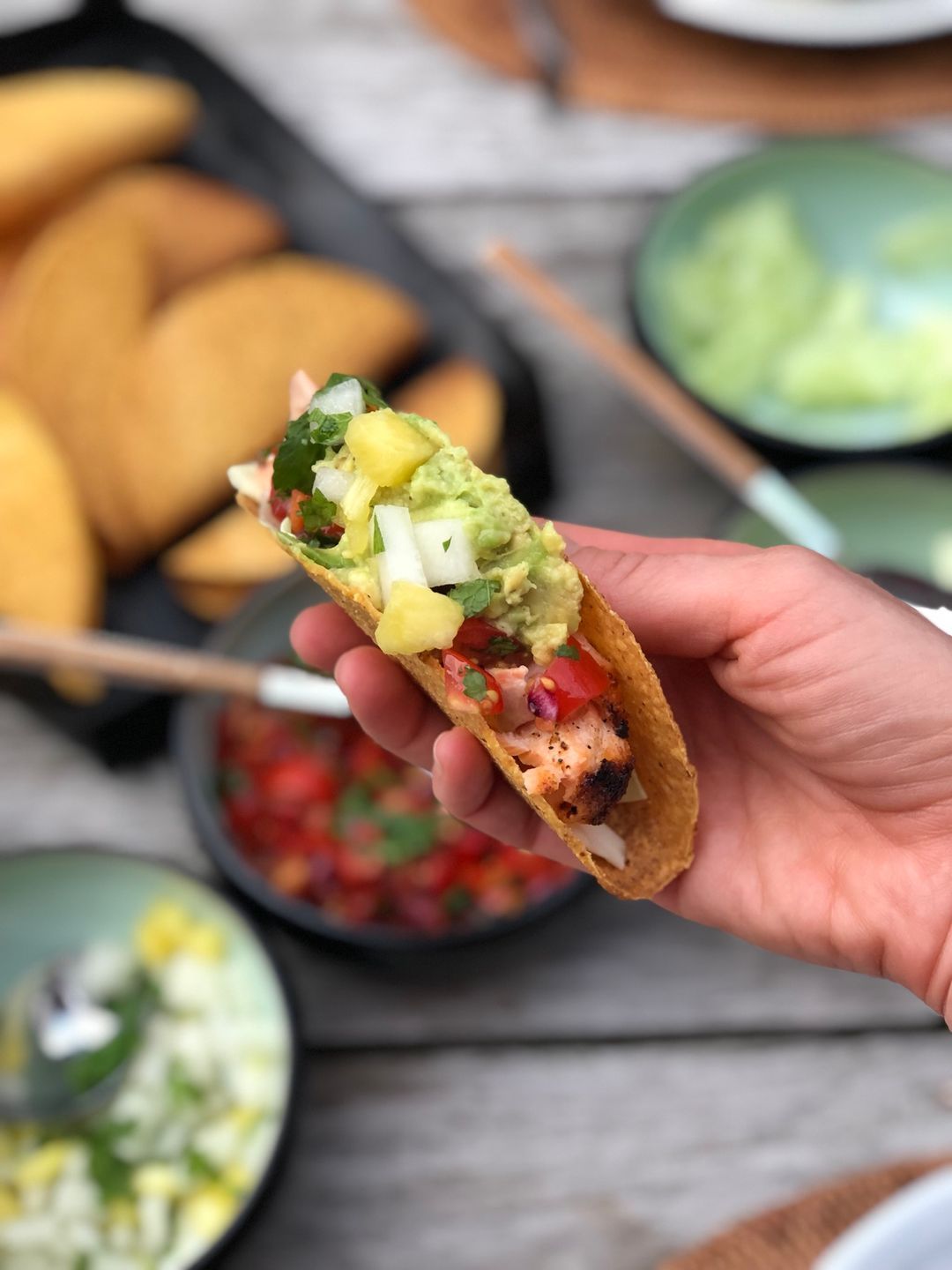 Salmon tacos with pico de gallo and pineapple and melon salsa