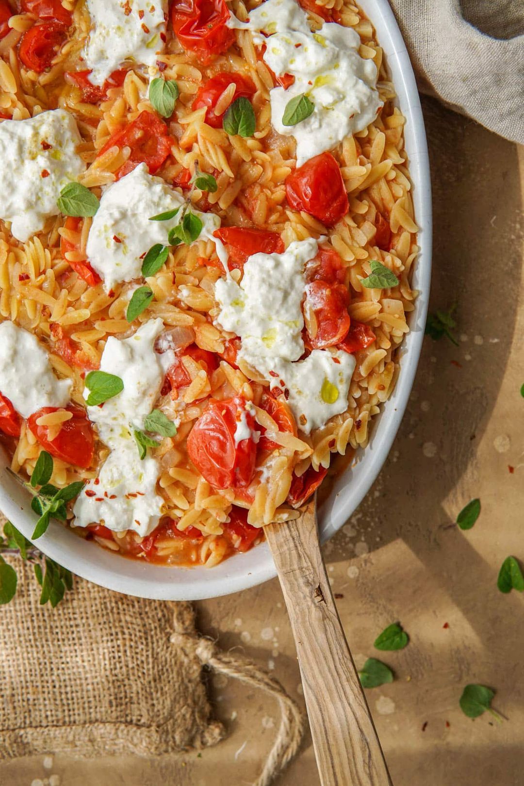 Vegetarian one-pot meal with orzo, tomato and burrata