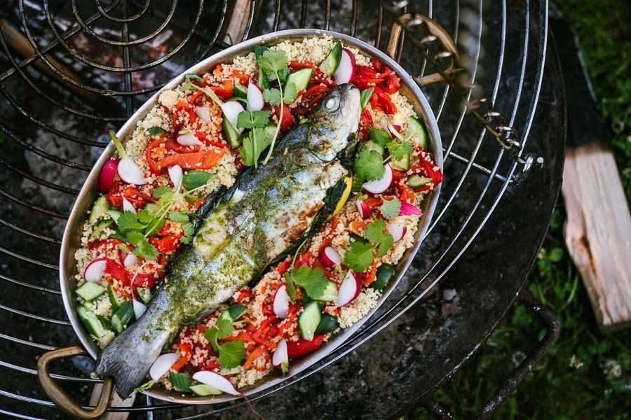 Grilled trout with couscous on the tripod BBQ