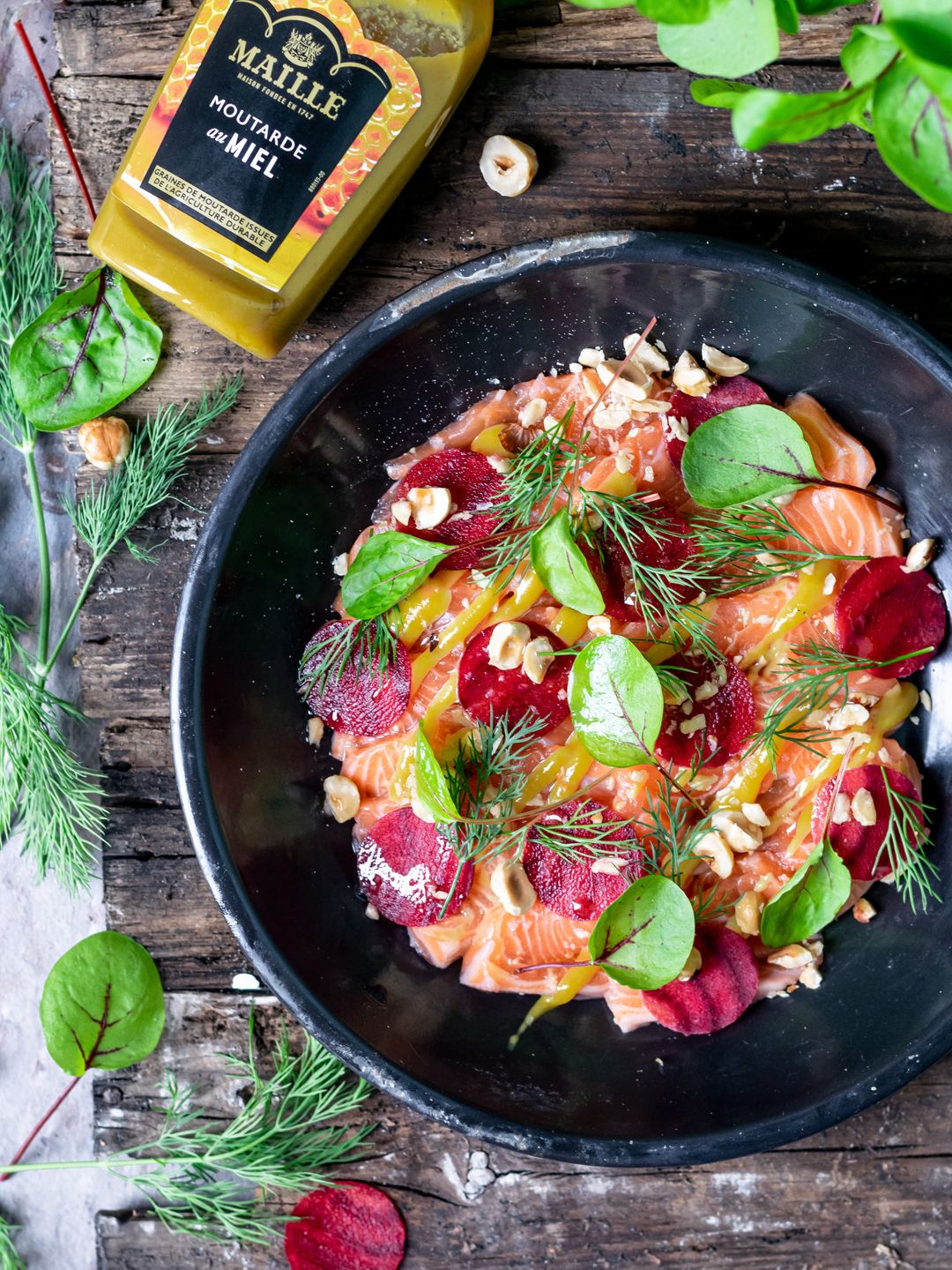 Salmon sashimi with beetroot, dill, hazelnut and honey mustard