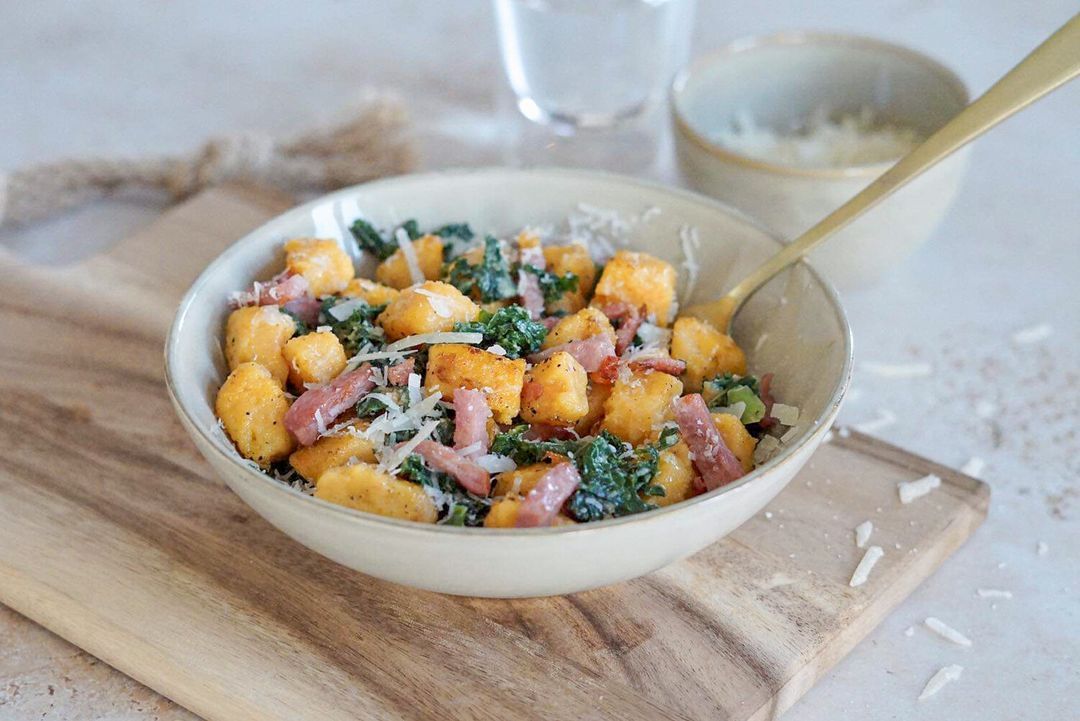 Sweet potato gnocchi with kale and bacon