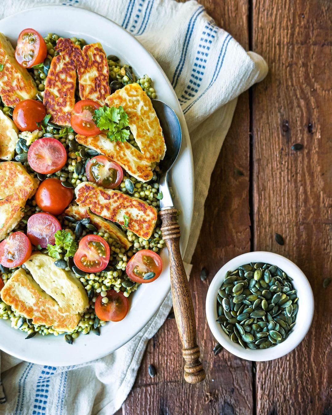 Pearl couscous with pesto, cherry tomatoes and halloumi.