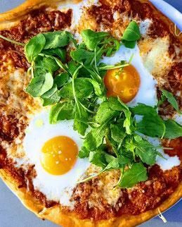 Pizza bolognese with two eggs