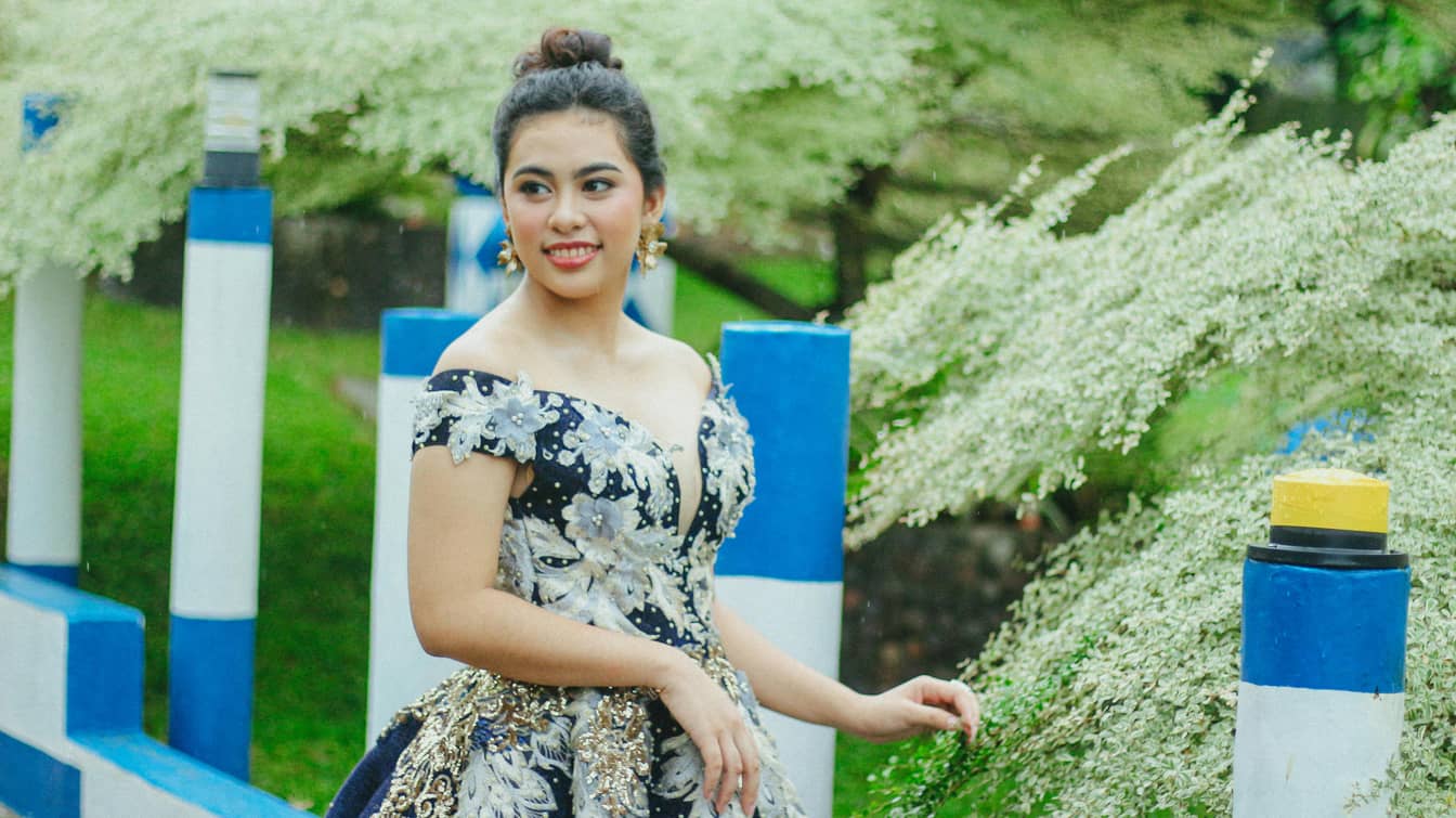 Elegant Woman in Delicate Dress in Garden