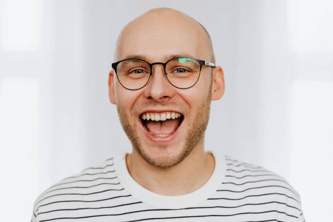 Joyful Bald Man with Glasses