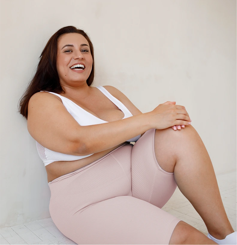 Smiling woman in activewear at the start of her weight-loss journey