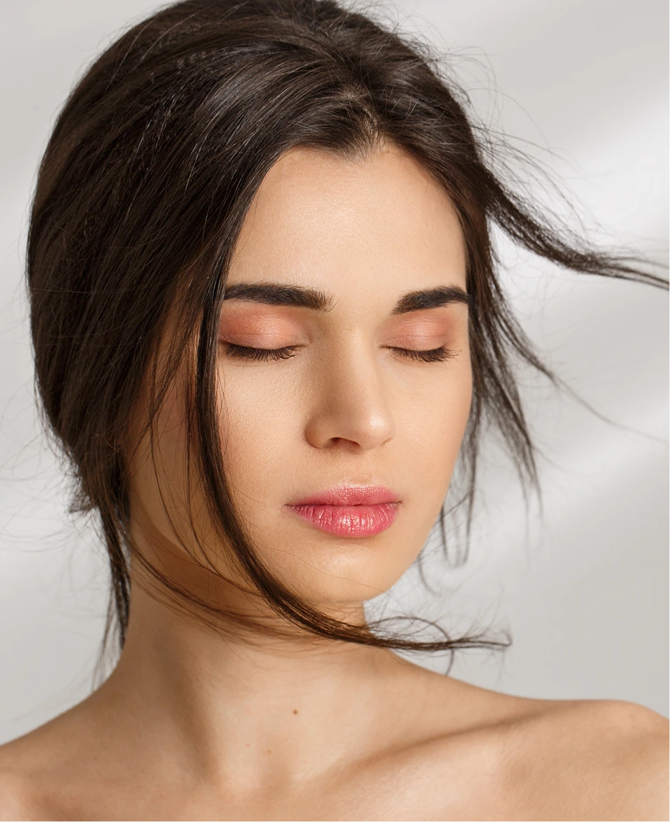 Woman with soft, smooth, naturally full lips and a calm expression