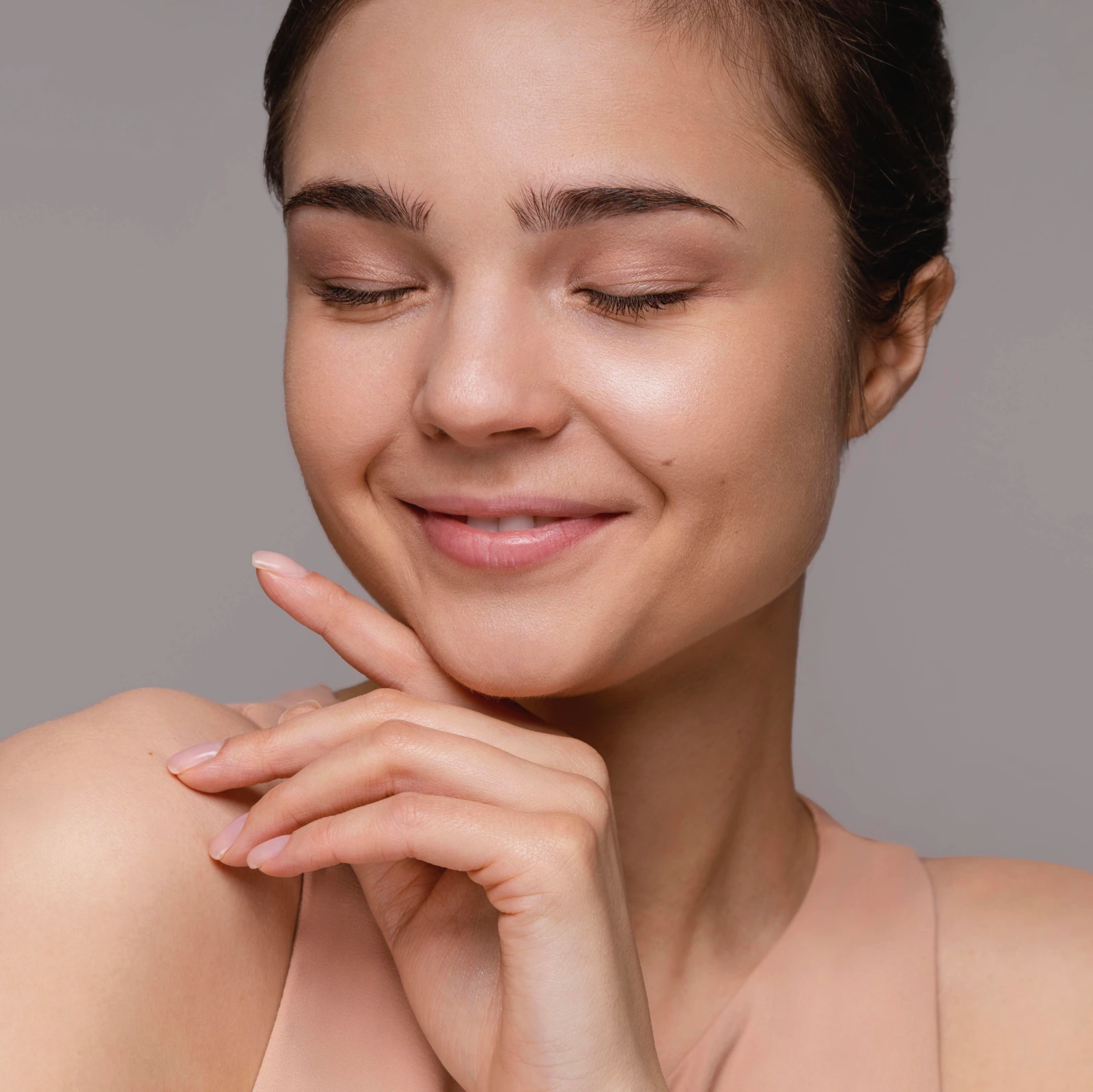 Beautiful woman in her 30s with smooth, glowing skin