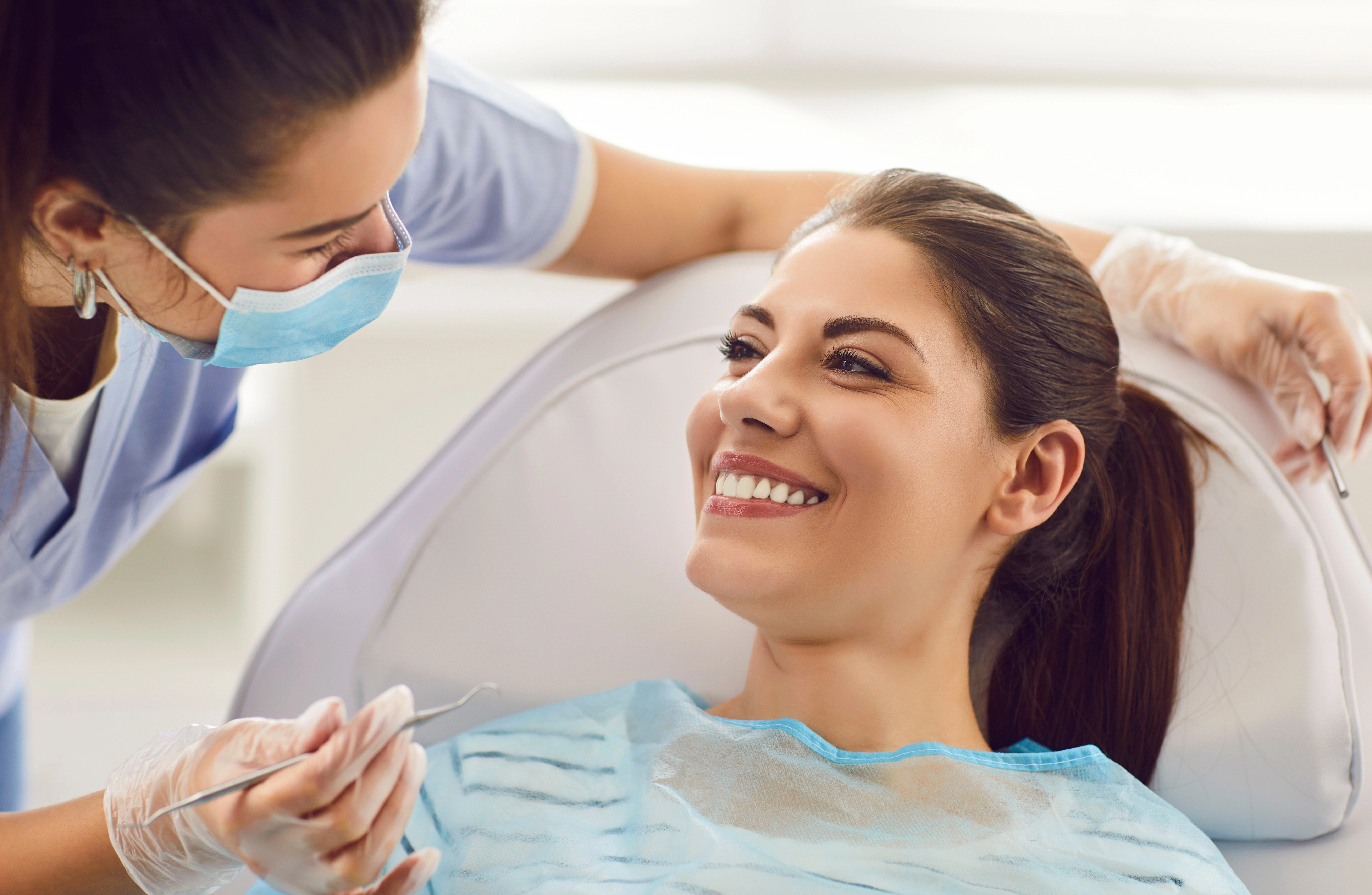 Patient reclining in a dental chair during treatment