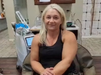 Patient seated in a treatment room at the practice